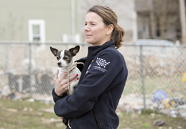 Member of The HSUS' Animal Rescue Team holds a dog rescued in the aftermath of Hurricane Sandy