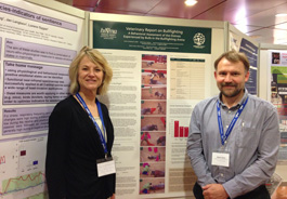 Drs. Krebsbach and Jones in front of the HSI bull fighting poster at the 2013 UFAW symposium